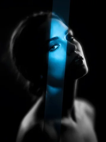 Blue-lit fractured portrait — Nano Banana 2 AI Prompt: { "subject": { "description": "A high-concept avant-garde portrait. The im...