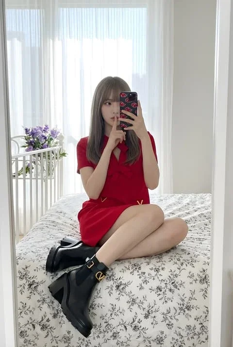 Soft Light Mirror Selfie on a Floral Bed