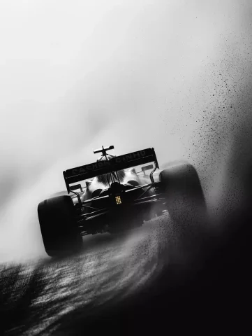 Cinematic F1 Speed Distortion — Midjourney v6 AI Prompt: Ultra-high-definition black-and-white cinematic Formula 1 spectacle, captured in...