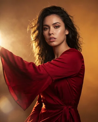 Product Marketing - Editorial Fashion Portrait with Wind Motion — Nano Banana 2 AI Prompt: Editorial fashion portrait, woman wearing flowing red bell-sleeve wrap dress, dr...