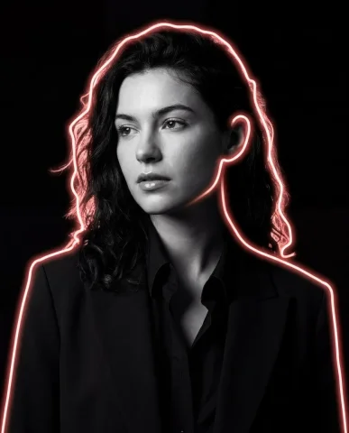 A man in black suit with red neon rim light looks away — Nano Banana 2 AI Prompt: Transform the reference image into a dramatic cinematic black-and-white portrait...