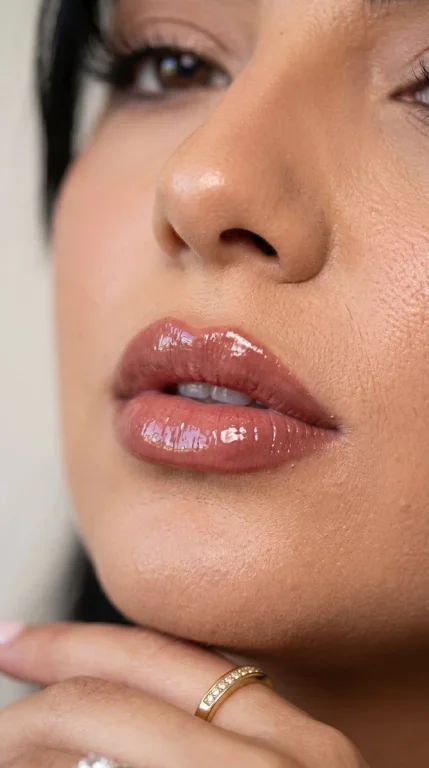 A glossy nude lipstick ad showcases ultra-realistic lip texture