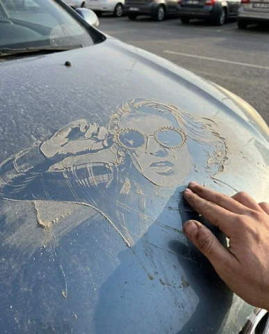 A Dusty Message Revealed: The Art of Imperfection — Nano Banana 2 AI Prompt: Transform the scene into a realistic outdoor setting where the phrase “Beni yıka...