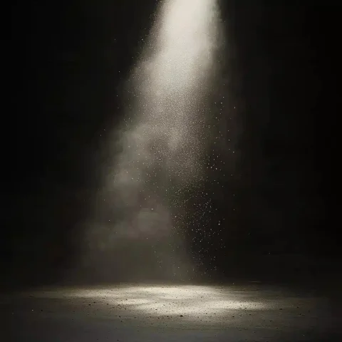 Dust Particles in Light — Midjourney v6 AI Prompt: a dark enviroment with a single light source with dust particiles floating in th...