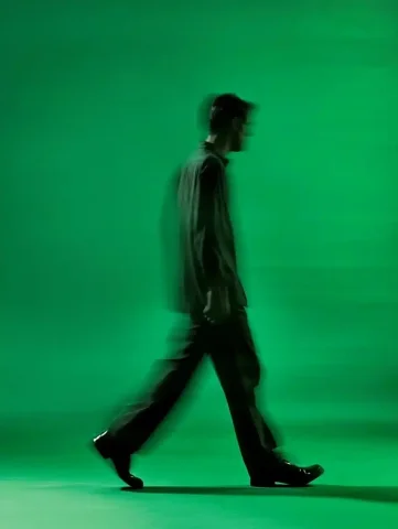 Motion Blur Man Walking — Midjourney v6 AI Prompt: a man walking, turned backward, long exposure shot, motion blur, full body, isol...