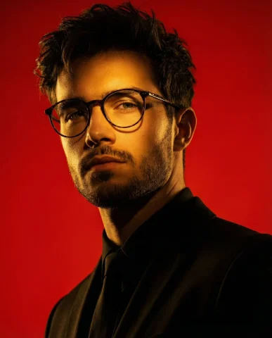 Cinematic Portrait of a Man in Dramatic Red Lighting — Nano Banana 2 AI Prompt: A low-angle cinematic portrait of a man in a black suit. Intense dramatic lighti...