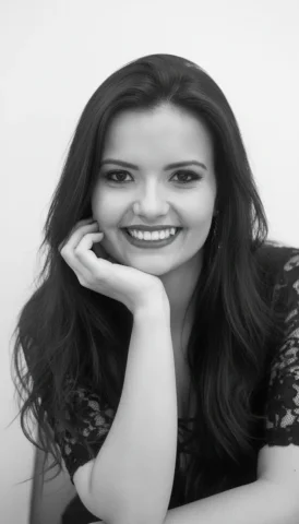 A High-Impact Black And White Studio Portrait, Capturing A Female — Nano Banana Pro AI Prompt: A high-impact black and white studio portrait, capturing a female figure with an...