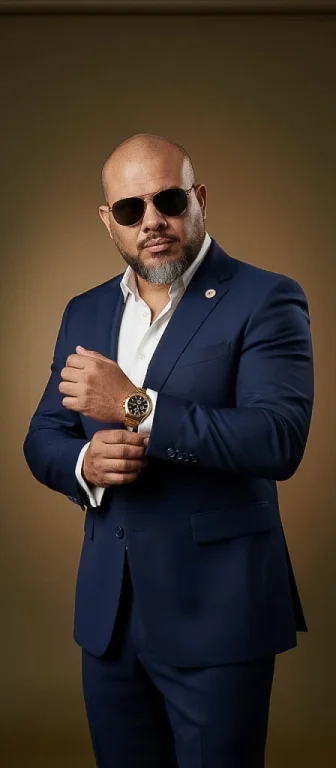 A Confident Man In A Navy Blue Tailored Suit With A White Shirt,