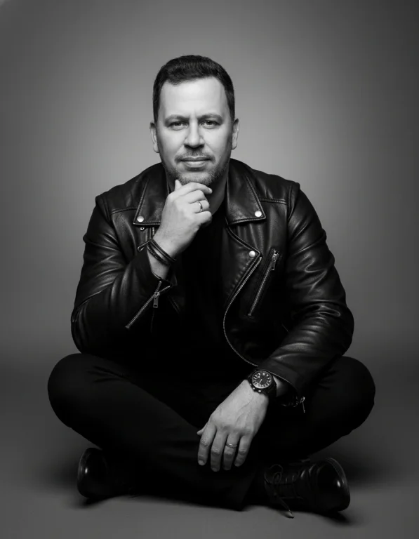 A Black And White, Full-Length Studio Portrait Capturing A Male F