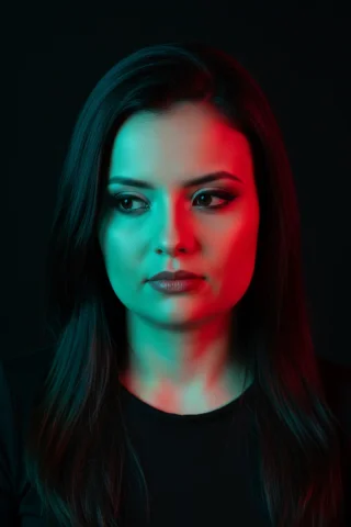 A Creative, High-Contrast Studio Portrait Capturing A Female Figu — Nano Banana Pro AI Prompt: A creative, high-contrast studio portrait capturing a female figure in an intima...