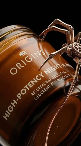 Steampunk Elegance: A Nighttime Skincare Marvel — Nano Banana 2 AI Prompt: Luxury skincare product shot featuring a cylindrical amber jar with a smooth, re...