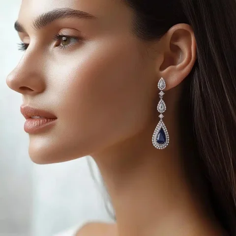 Elegant Teardrop Earrings Design — Midjourney v6 AI Prompt: Long earrings featuring a combination of white teardrop-shaped zirconia and sapp...