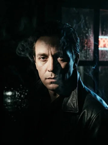 Noir Mystique: A Cinematic Portrait — Nano Banana 2 AI Prompt: Dark cinematic portrait in film noir style, the person looking directly at camer...