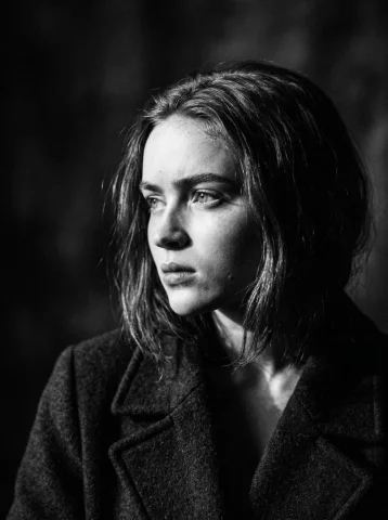 Noir Elegance in Every Detail — Nano Banana 2 AI Prompt: Cinematic black and white close-up portrait of the reference face, dramatic side...