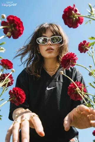 Futuristic Streetwear Meets Floral Beauty — Nano Banana 2 AI Prompt: A dramatic extreme low-angle shot looking up at a women with brown hair as in pi...