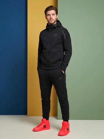 Bold Street Style in High-Fashion Sportswear — Nano Banana 2 AI Prompt: Make an image of man standing confidently against a plain, multiple coloured wal...