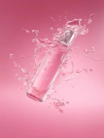Skincare Product in OC Rendering — Midjourney v6 AI Prompt: Splashes of water, a skincare product suspended sideways in the picture, oc rend...