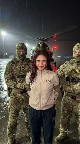 Rain-Soaked Runway Standoff: Officers Hold Woman, Helicopter Blades Spin — Nano Banana 2 AI Prompt: Using the attached reference photo as the basis for the appearance of the centra...