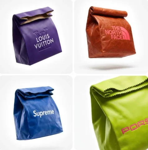 Brand Name. A High-End Conceptual Leather Clutch Designed In The — Nano Banana Pro AI Prompt: [BRAND NAME]. A high-end conceptual leather clutch designed in the exact shape a...