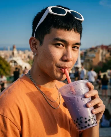 Barcelona Rooftop Boba Streetwear Portrait 2 — Nano Banana AI Prompt: Close-up of a young man mid-sip of taro boba tea on a Barcelona rooftop, golden...