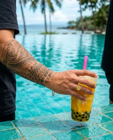 Poolside Boba Streetwear Editorial 5 — Nano Banana AI Prompt: Filipino man squatting at an aquamarine infinity pool holding mango boba, cyan w...