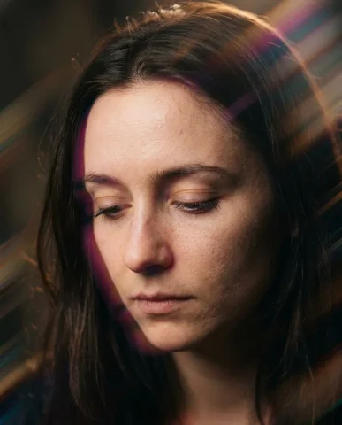 Chromatic Motion-Streak Portrait 5 — Nano Banana AI Prompt: Portrait where deliberate slow-shutter camera capture during a slight head turn...