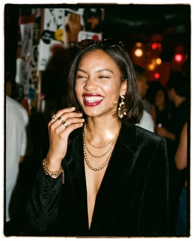 90s Paparazzi Glamour 2 — Nano Banana AI Prompt: Hard-flash photography with visible hotspot on her collarbone and sharp shadow c...