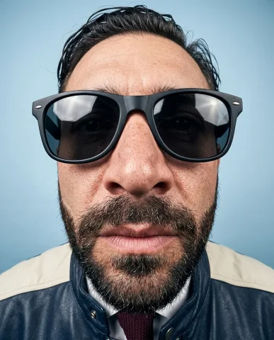Ultra-Wide Lens Dynamic Studio Portrait 4 — Nano Banana AI Prompt: Ultra-realistic extreme close-up studio portrait with a 14mm ultra-wide lens pos...