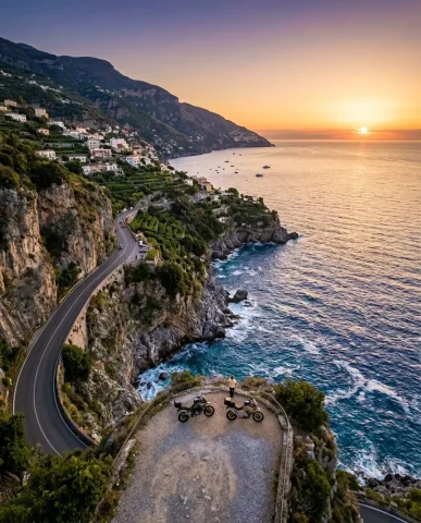 Adventure Motorcycles on Amalfi Coast at Sunset 6 — Nano Banana AI Prompt: Wide aerial view of the Amalfi Coast road winding along dramatic cliffs, two tin...