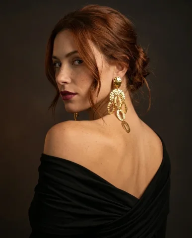 Valentino Style Gold Statement Earrings Portrait 6 — Nano Banana AI Prompt: The black jersey top drapes off-shoulder in the lower frame. The composition cre...