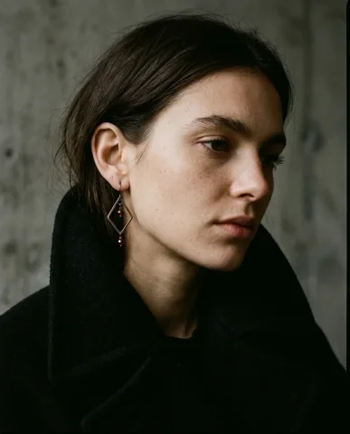 Celine Style Effortless Gold Earrings Close-Up 1 — Nano Banana AI Prompt: Editorial three-quarter portrait of a female model in an unstructured oversized...