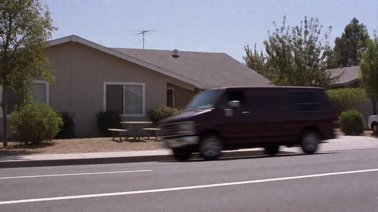 Scrtry2002, A Dark-colored Van Moves Swiftly Past A Single-s...