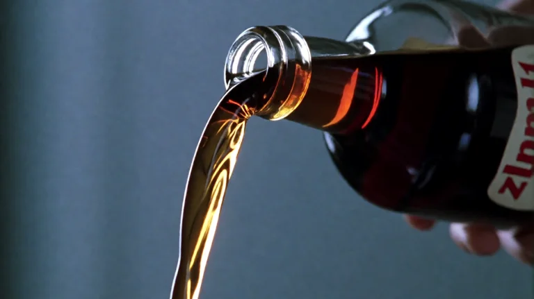 Zlndr2001, A Dark Amber Liquid Pours Smoothly From The Neck...