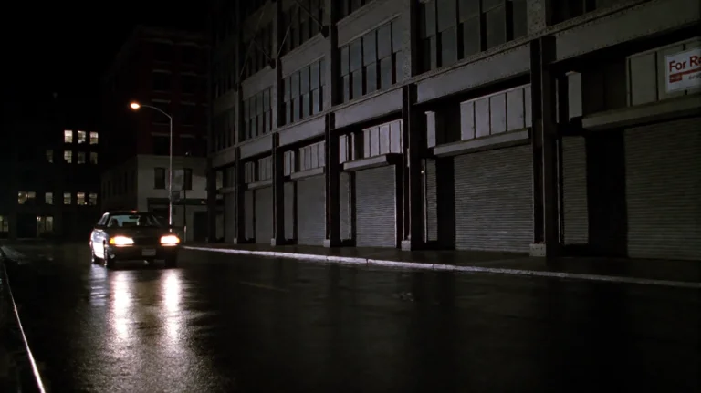 Zlndr2001, A Lone Car With Headlights On Drives Down A Wet,...