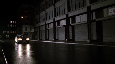 Zlndr2001, A Lone Car With Headlights On Drives Down A Wet,... — Stable Diffusion AI Prompt: zlndr2001, A lone car with headlights on drives down a wet, reflective city stre...