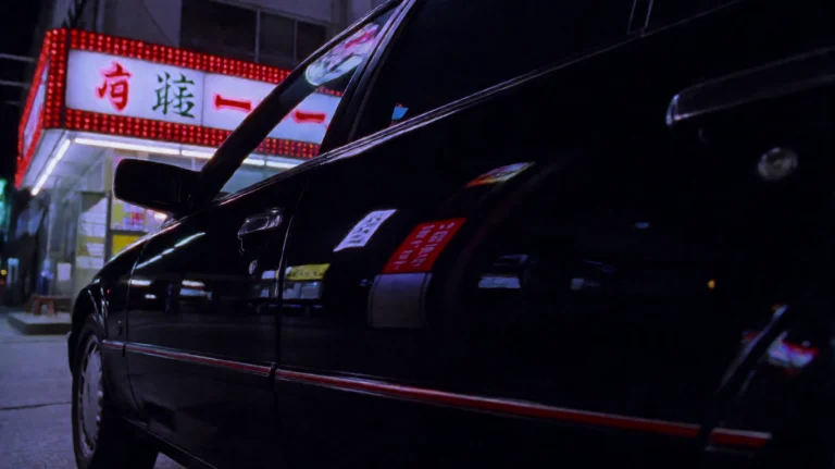 Mystrymn1999, A Sleek, Glossy Black Car Is Parked At Night,...