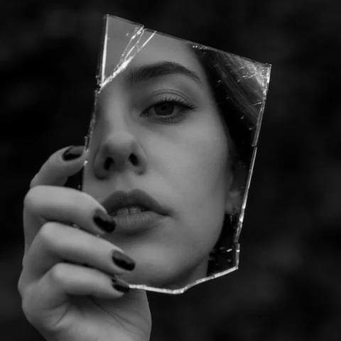 Dark Mirror Woman Face — Stable Diffusion AI Prompt: Reflection of woman face, close-up from lips to eyes, in a a piece of broken mir...