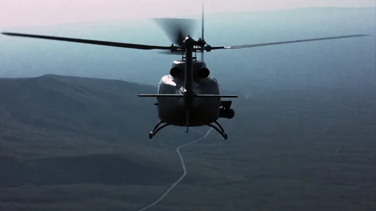 Rgnfr2002, A Dark, Military-style Helicopter Is Captured In...