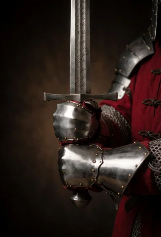 Close-up Of A Warriors Gauntleted Hands Gripping A Longsword... — Stable Diffusion AI Prompt: Close-up of a warrior's gauntleted hands gripping a longsword in a two-handed gr...