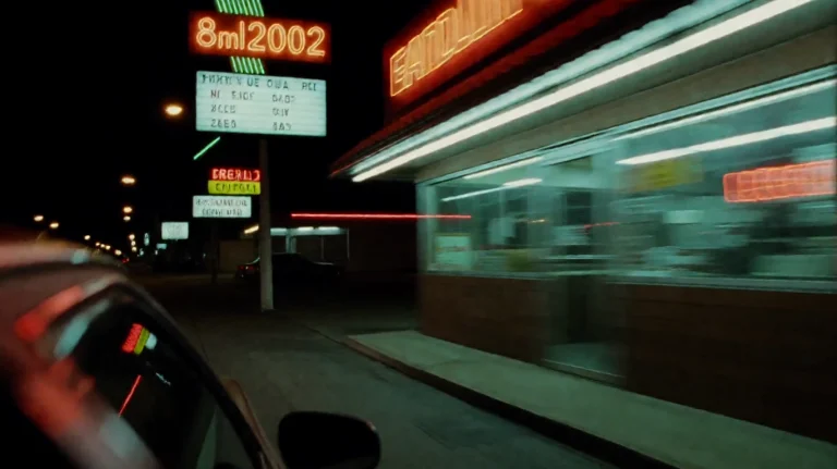 8ml2002, A Vehicle Speeds Past A Roadside Diner At Night, It...