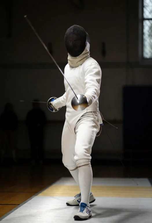 A Fencer Holding A Rapier With A Swept Hilt In Guard Stance,...
