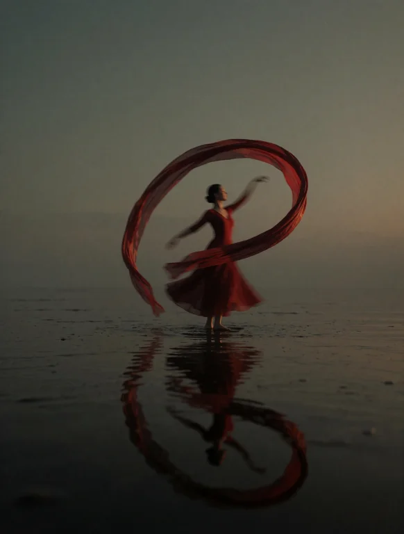 A Solitary Dancer On A Black Mirror Of Shallow Water At Dusk...