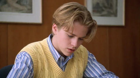 Crlintntns1999, A Young Person With Tousled Blonde Hair Is S... — Stable Diffusion AI Prompt: crlintntns1999, A young person with tousled blonde hair is seated, looking downw...