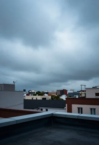 A Rooftop View Of A City Under Low Clouds, Surrealism, Long... — Stable Diffusion AI Prompt: a rooftop view of a city under low clouds, surrealism, long exposure, negative s...