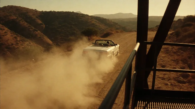 Swrdfsh2001, A Silver Convertible Speeds Along A Dusty, Unpa...