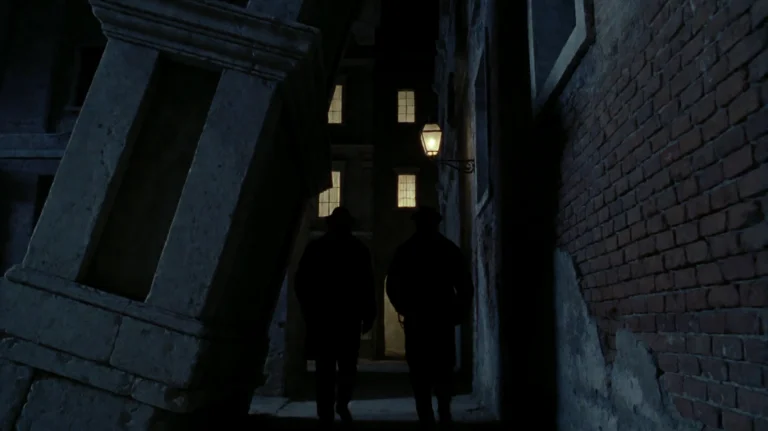 Cntmntcrst2002, Two Silhouetted Figures Walk Through A Narro...