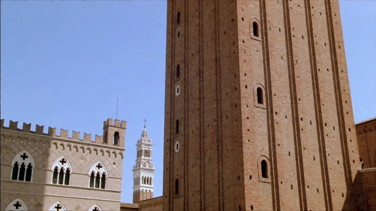 Tlntdmrrpl1999, A Tall, Reddish-brown Brick Tower With Narro...