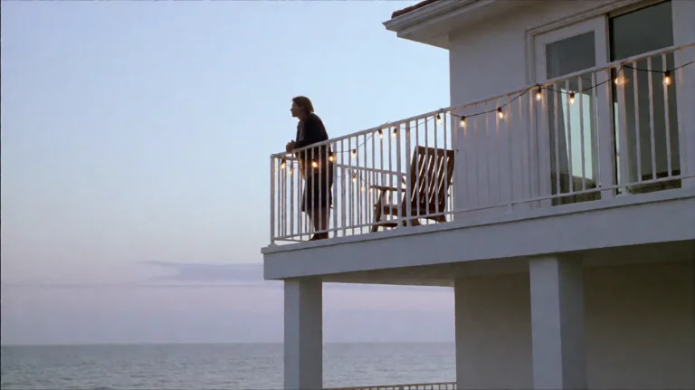 Tlntdmrrpl1999, A Person Stands On A White Balcony Overlooki...