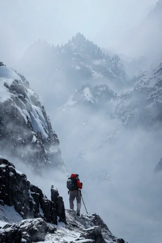 Mountain Climber Hiking Up A Mountain, Snowy, Cold, Foggy An... — Stable Diffusion AI Prompt: Mountain climber hiking up a mountain, snowy, cold, foggy and misty, overcast da...