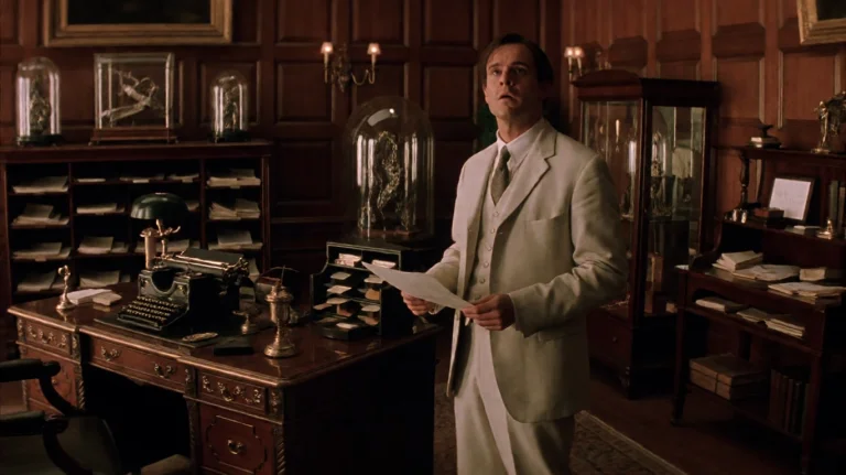 Tmmchn2002, A Man In A Light-colored Suit Stands In A Richly...